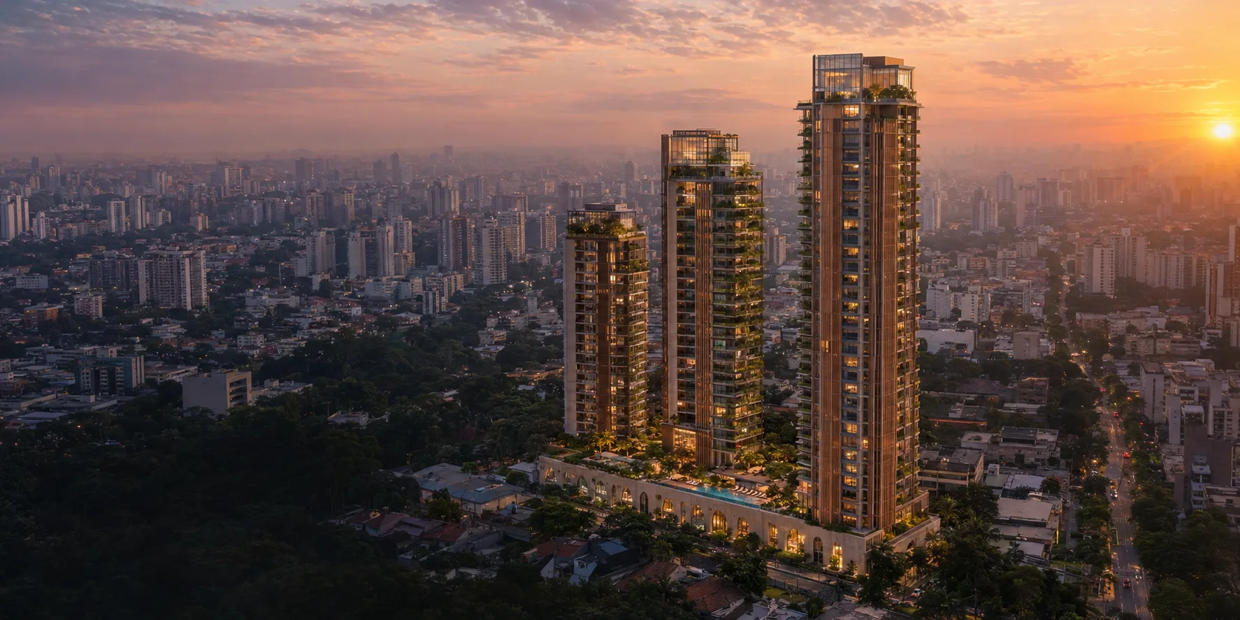 Vista aérea de um condomínio de torres residenciais ao entardecer, em São Paulo
